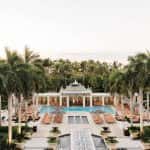 Lush palm trees line the fountains and pool at the Hyatt Regency Coconut Point
